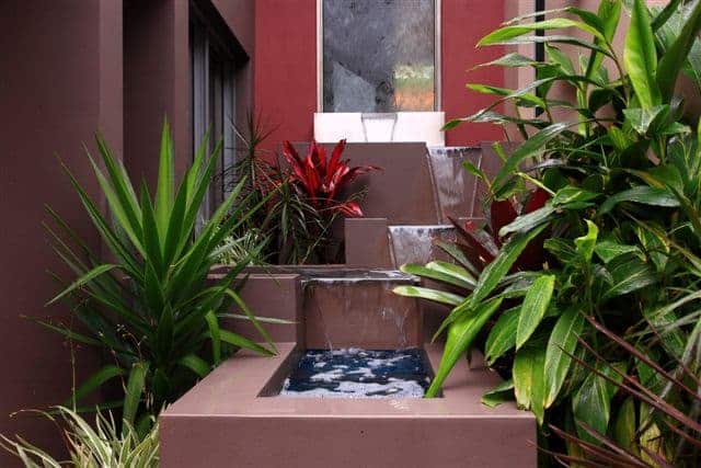 stepped landscaping hilly garden water fountain