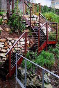 wooden stairs on hill landscaping design