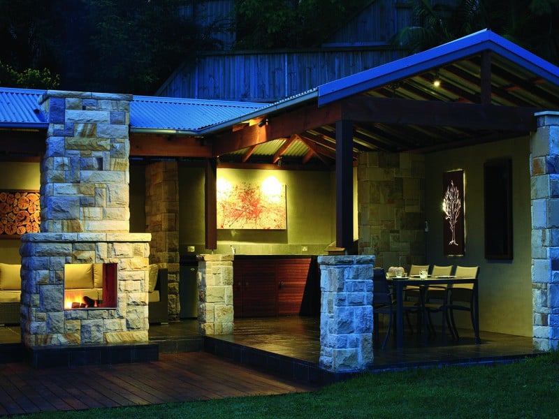 backyard outdoor living area stone wall landscaping