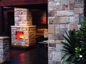 backyard outdoor living area stone wall landscaping